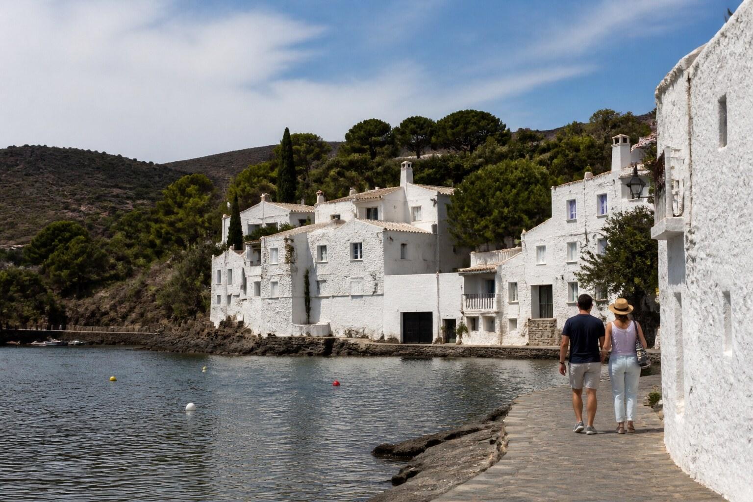 White Dalí house and olive trees beside Portlligat bay