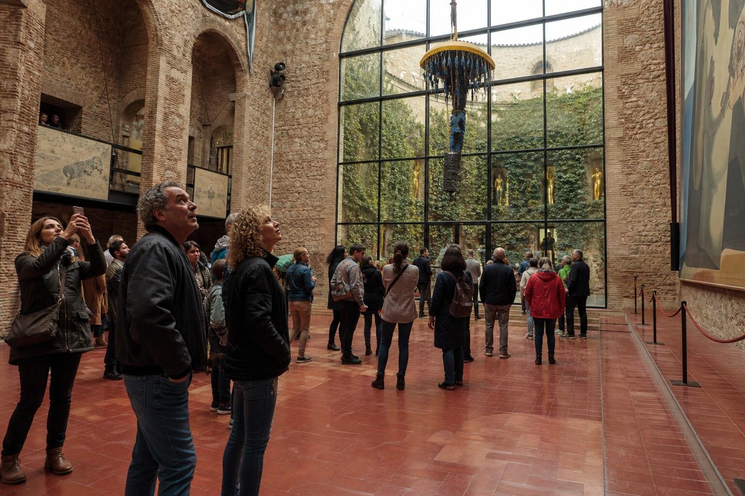 Visitors queuing at a Dalí museum entrance
