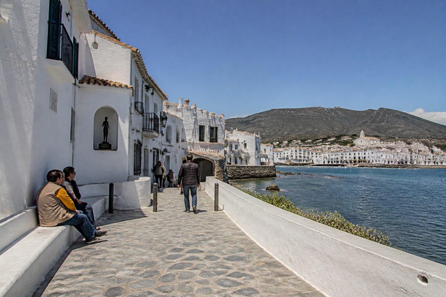 White waterfront buildings and lane in Cadaqués